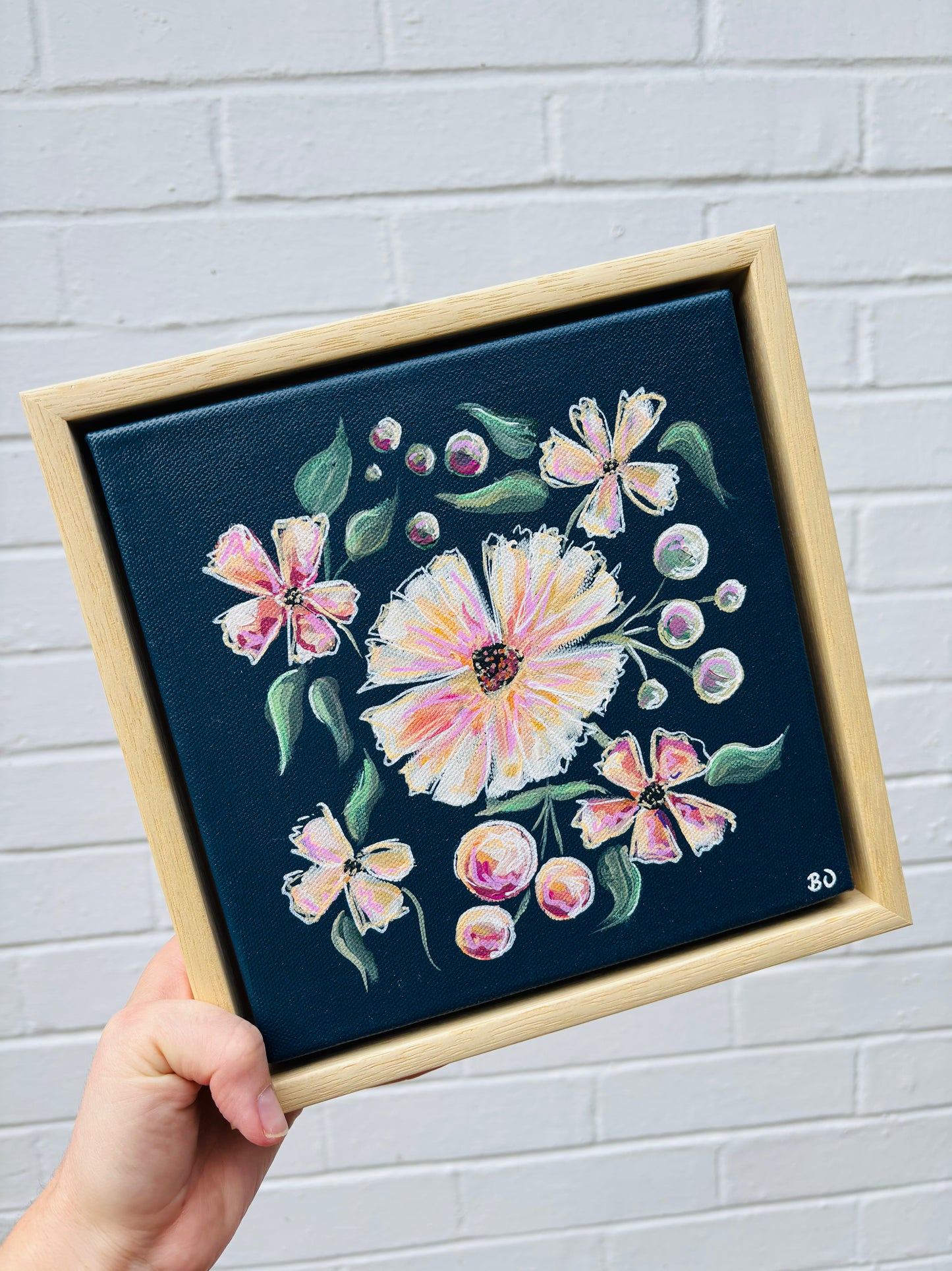 Dark blue mini canvas with soft pink peach florals in pine floater frame. Affordable original art hitchin letchworth hertfordshire