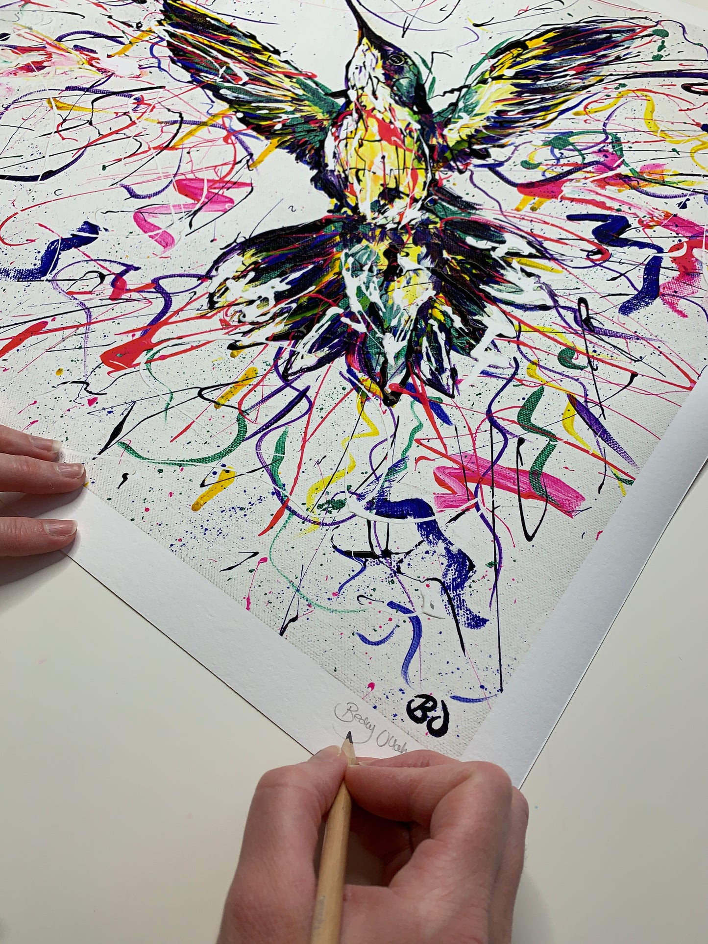Signing the 50 x 50 cm limited edition print