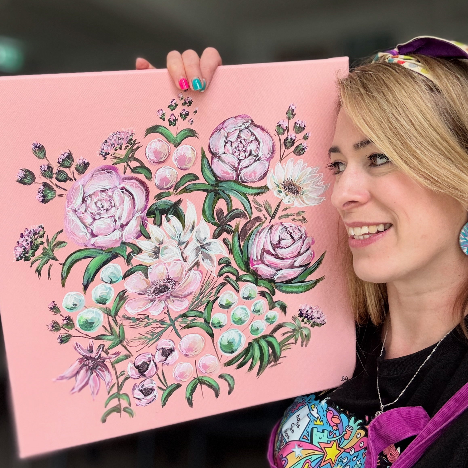 Me holding pink floral artwork ready for the Hitchin Big Art Fair