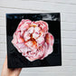 Pink flower on black background with resin coating on panel. Hitchin Letchworth Hertfordshire original art
