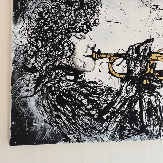 video of drip painting of trumpet player, demonstrating gold-leaf